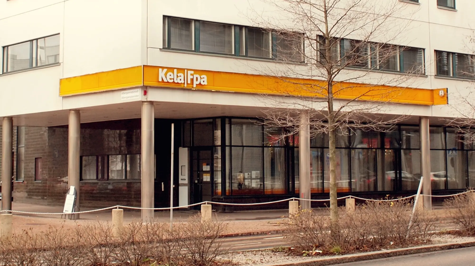 A Kela office in Leppävaara, Espoo, with the yellow Kela Fpa sign above its glass shopfront.