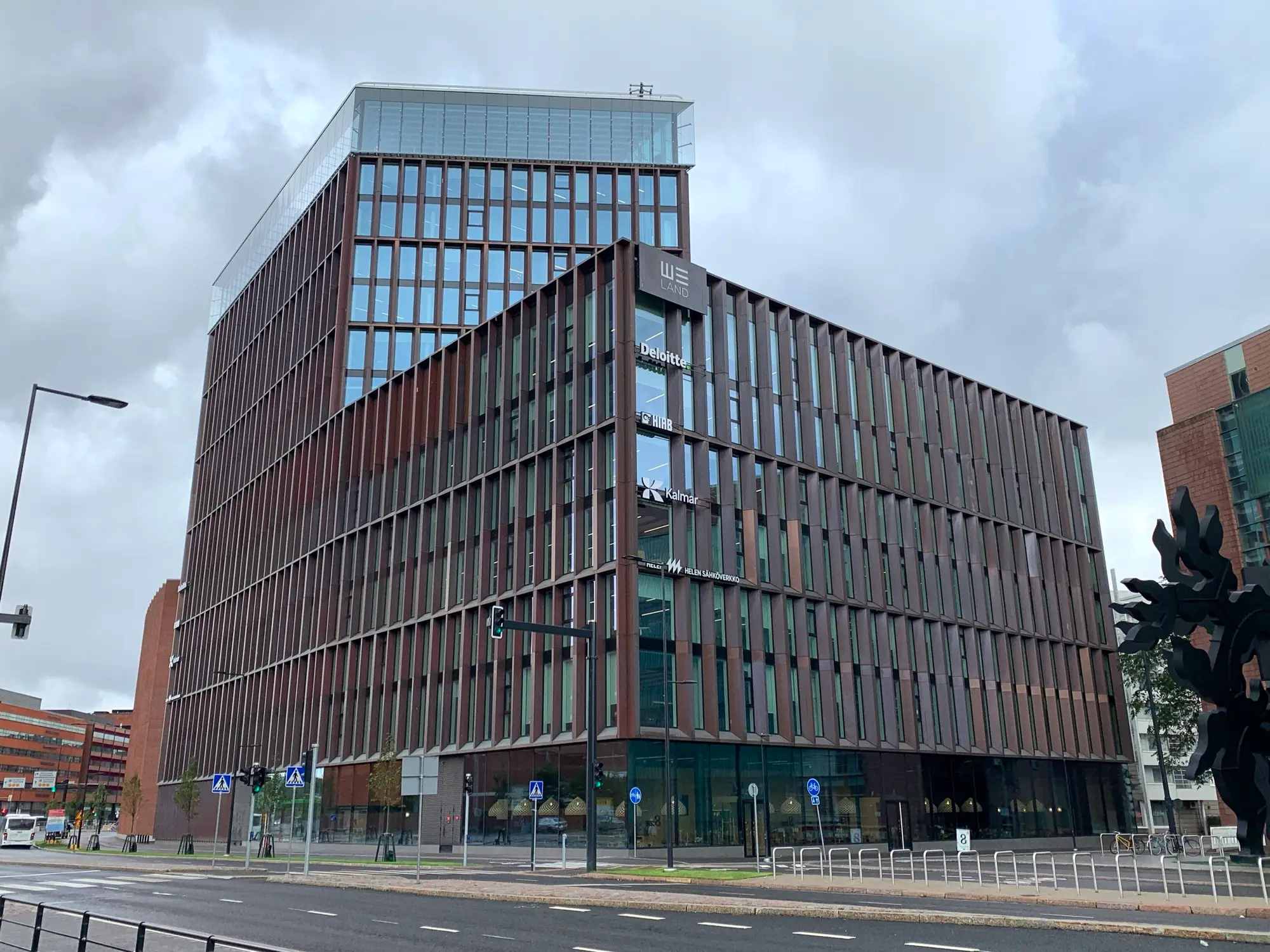 The modern We Land office building with a vertical-finned facade on Porkkalankatu in Ruoholahti, Helsinki.