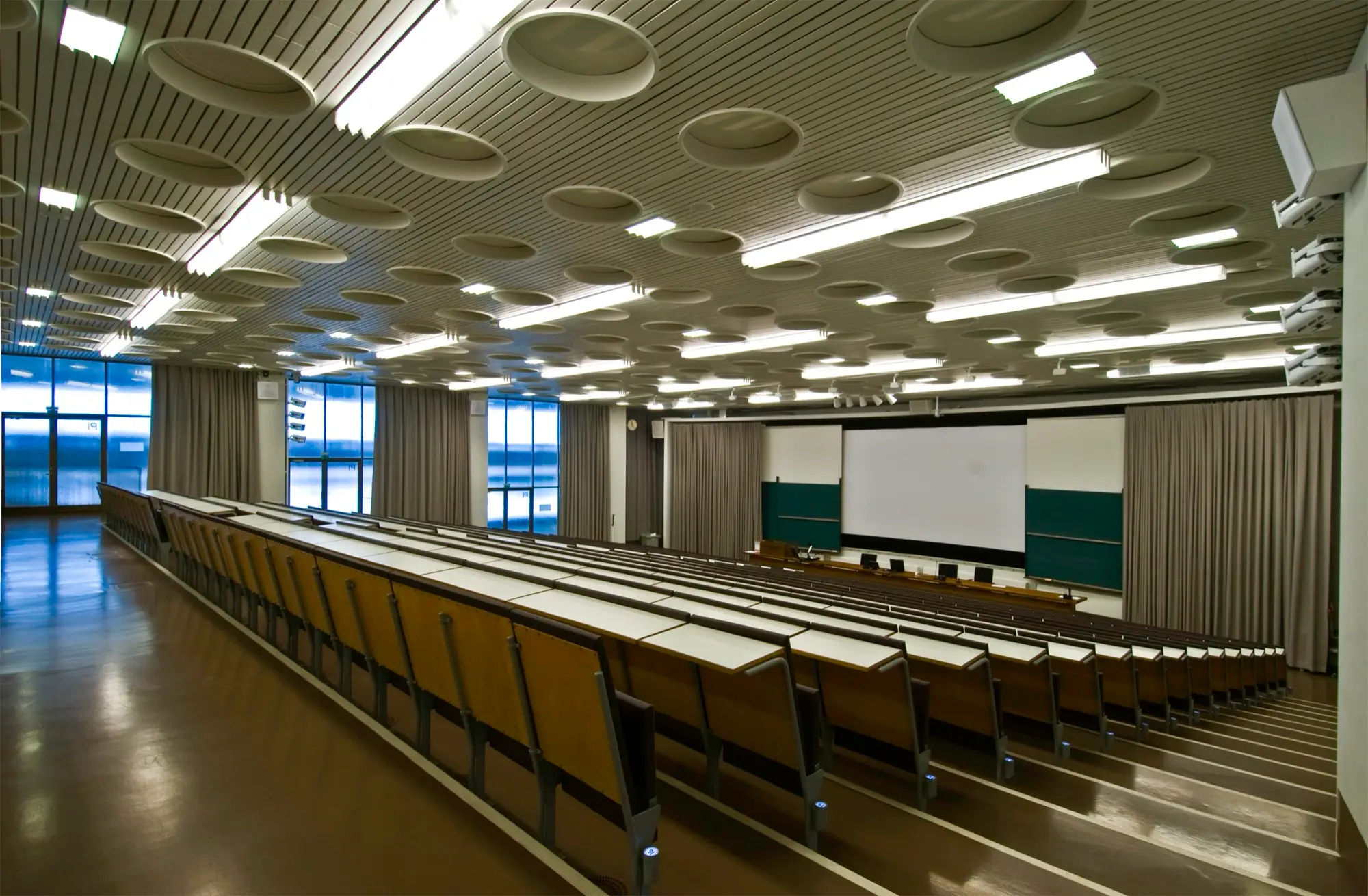 Rows of empty seats in the large lecture hall of the Porthania building at the University of Helsinki.